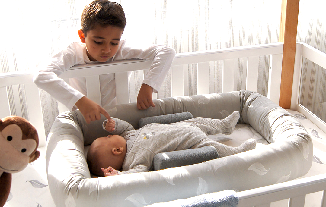 Newborn sleep positioner best sale